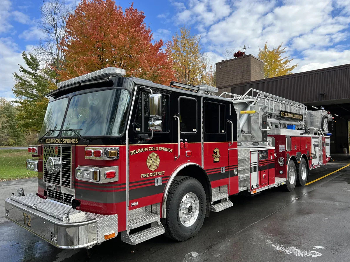 Fire apparatus in front of a fire station written on it Belgium Cold Springs Fire District